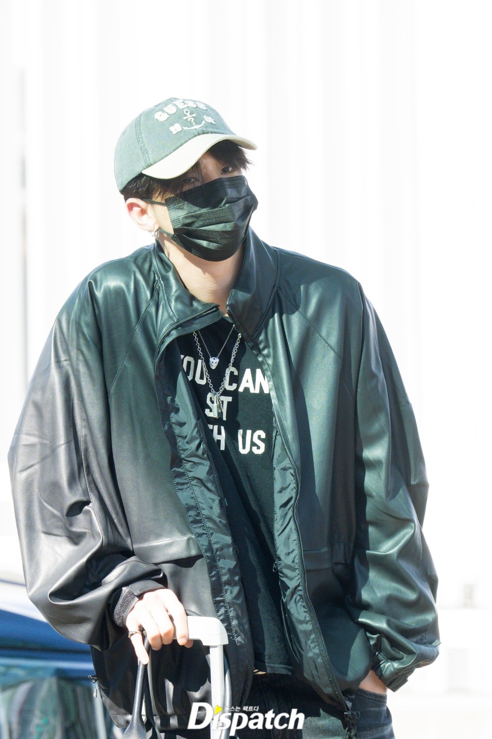 Hyunjin in a leather jacket and green-and-cream cap at his published September 24 appearance.